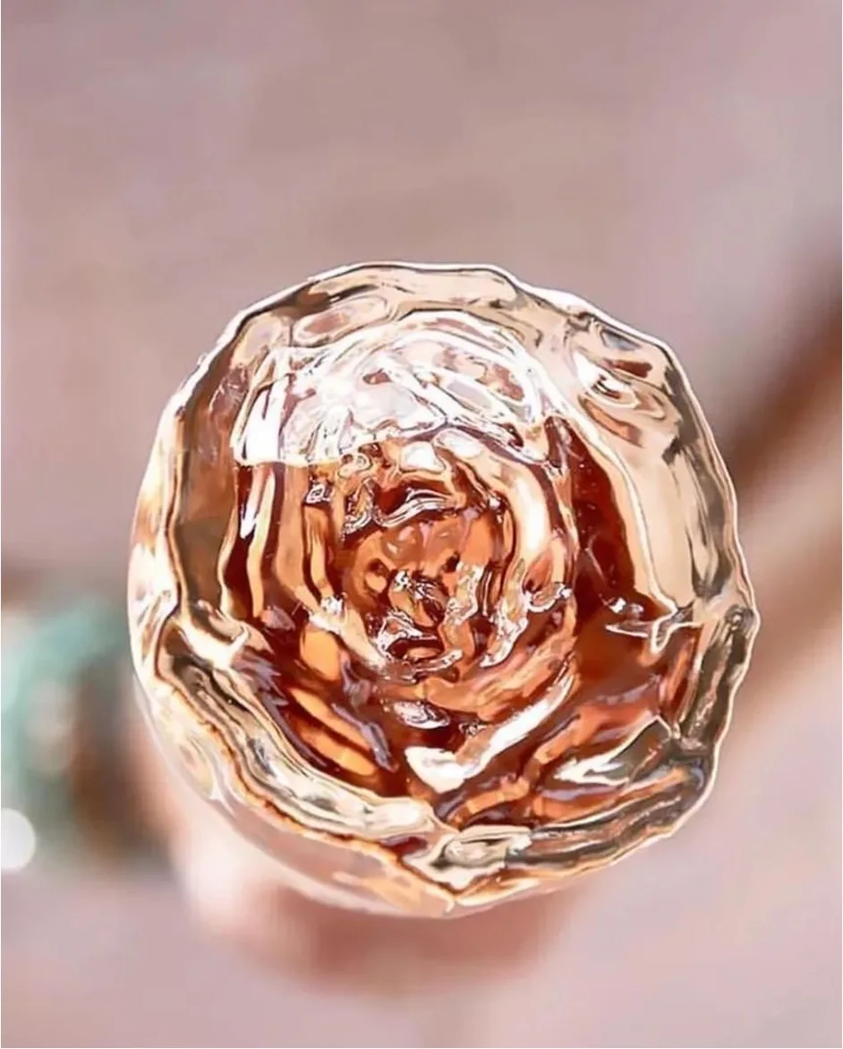 The iconic rose embossed on the bottle